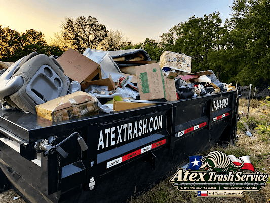 Loaded Atex 14-yard roll-off container on a North Texas job