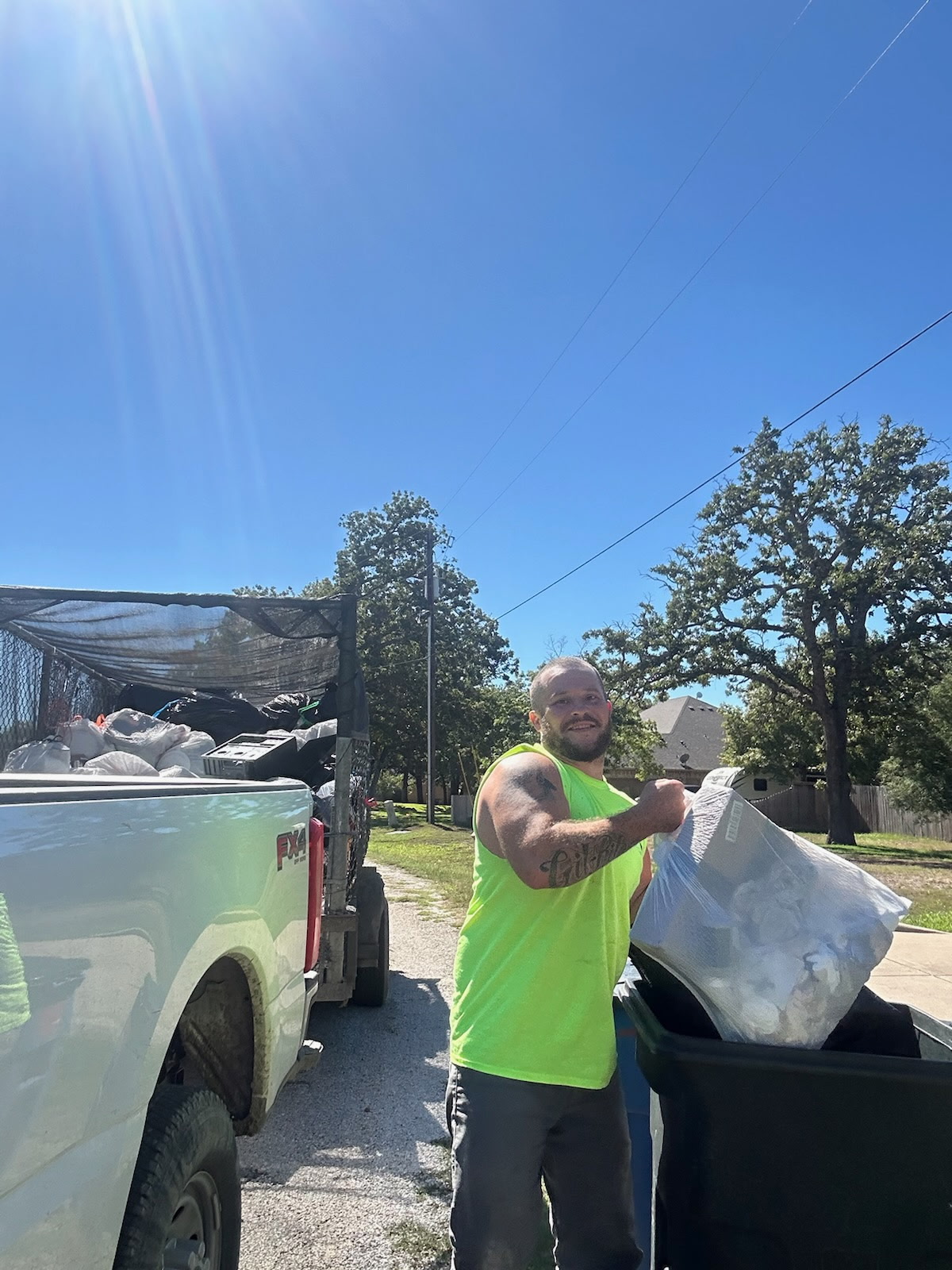 Atex Trash team loading trash bags during a neighborhood route